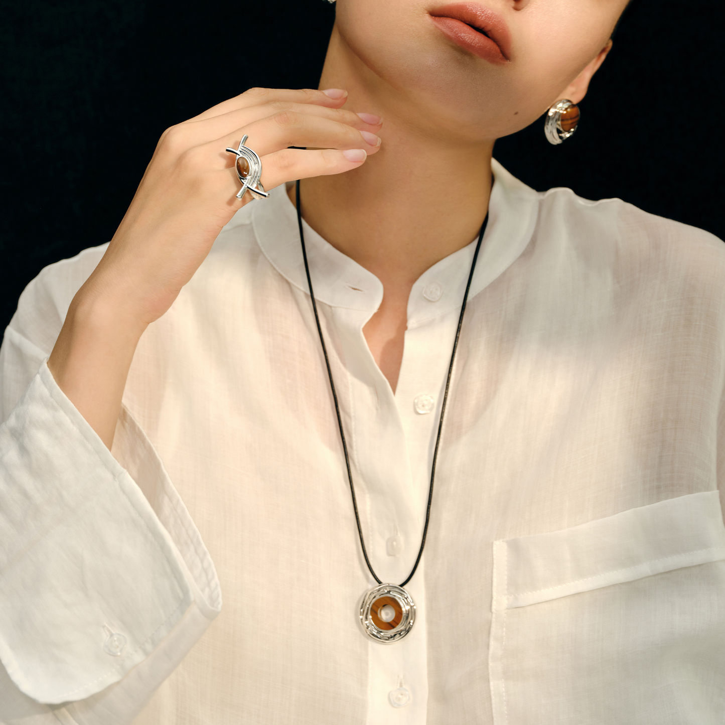 Wood grained stone leather cord necklace