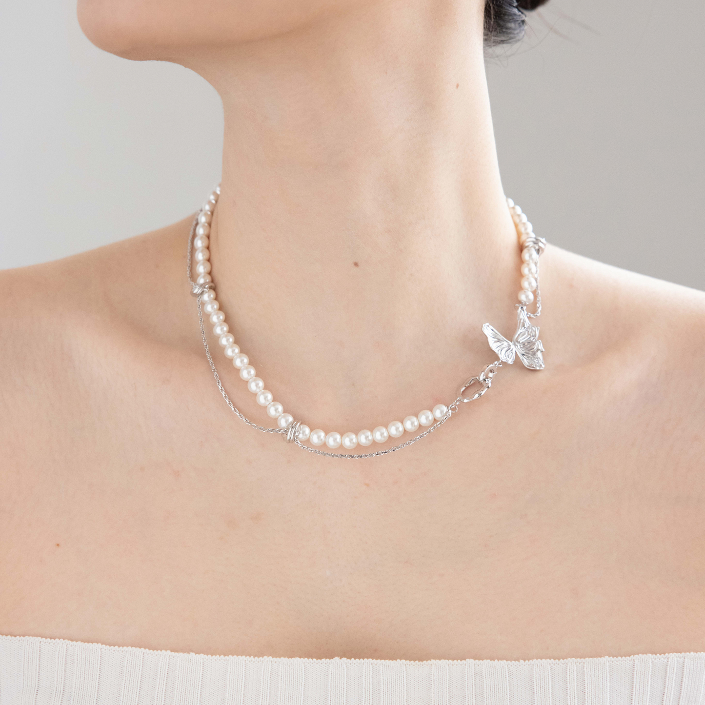 Double entwined butterfly pearl necklace